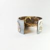 Manchette en argent massif 925 ornée de feuilles de Ginkgo Biloba dorées à l'or fin 18 carats. Travail artisanal unique, ciselure et repoussé. Bijoux joaillier créateur Ardèche Tournon sur Rhône bijou unique